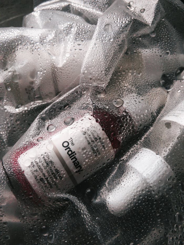 services-04 Detail shot of skincare serum bottles with water droplets, emphasizing freshness and hydration.