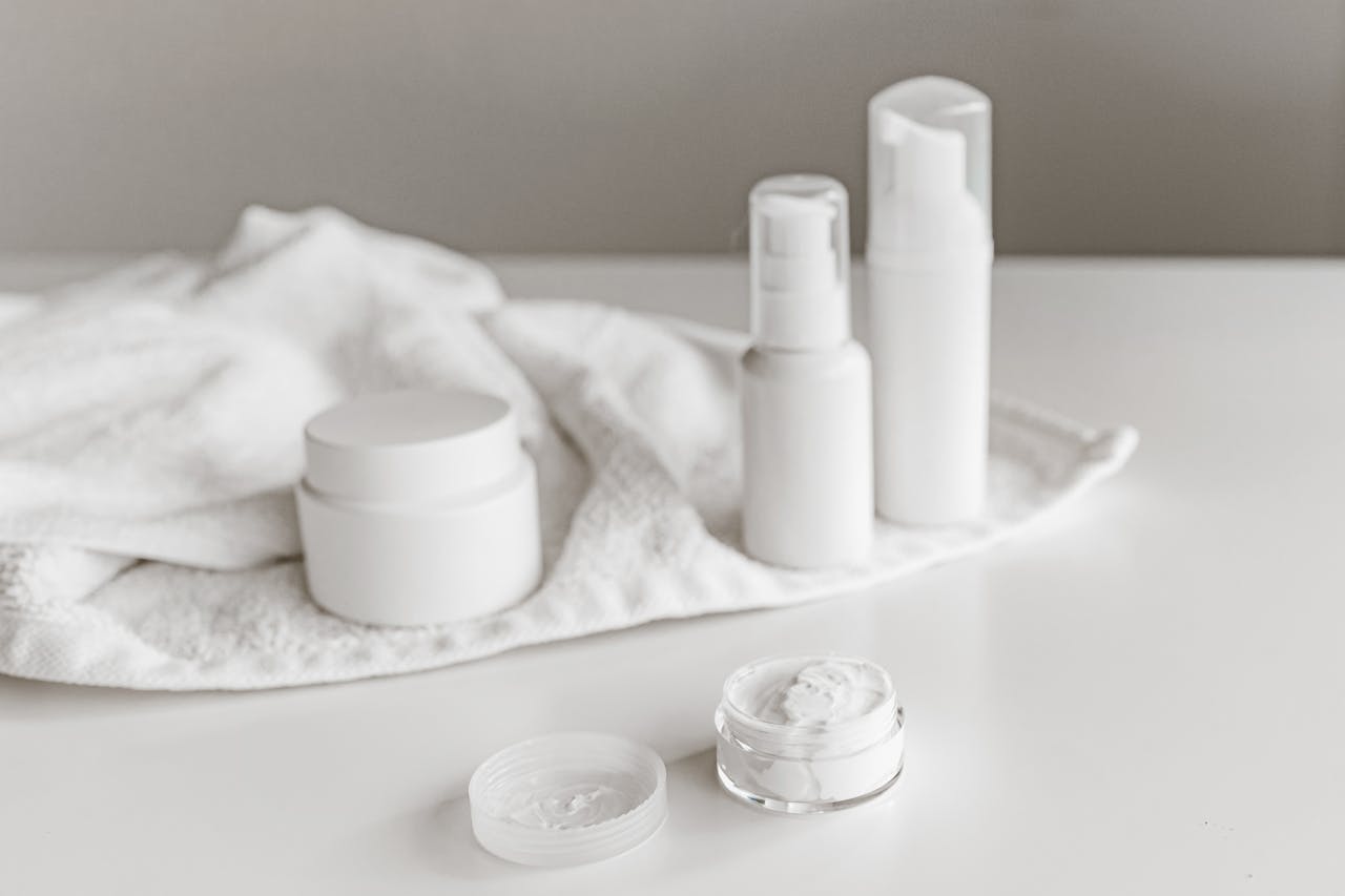 The Art of Drawing Readers In: Your attractive post title goes here Elegant display of skincare products on a white surface, highlighting simplicity and purity.